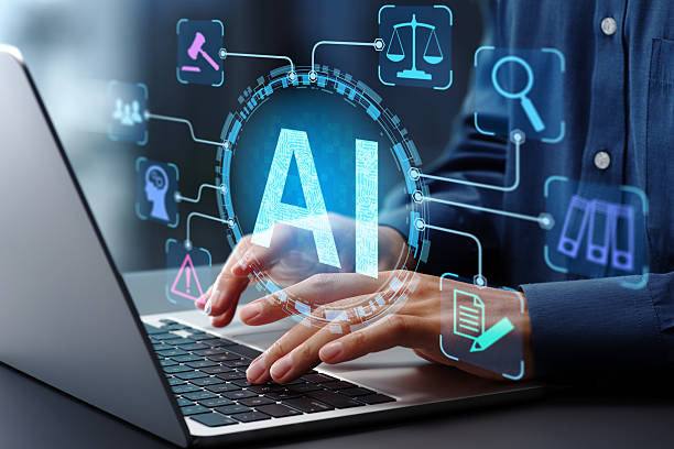 Understanding Artificial Intelligence: A Complete Guide businessman typing on laptop computer keyboard at desk in office.